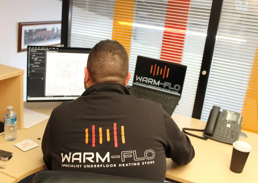 Aaron from Warm-Flo working at his desk.